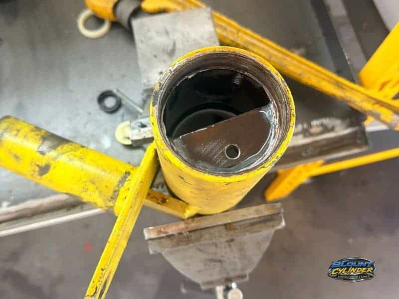 yellow hydraulic cylinder housing