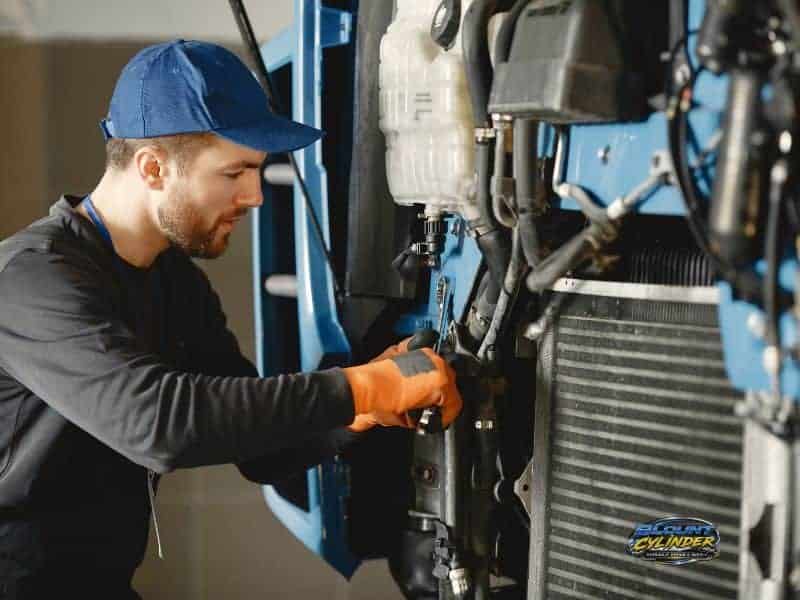 Man working on industrial equipment in a workshop